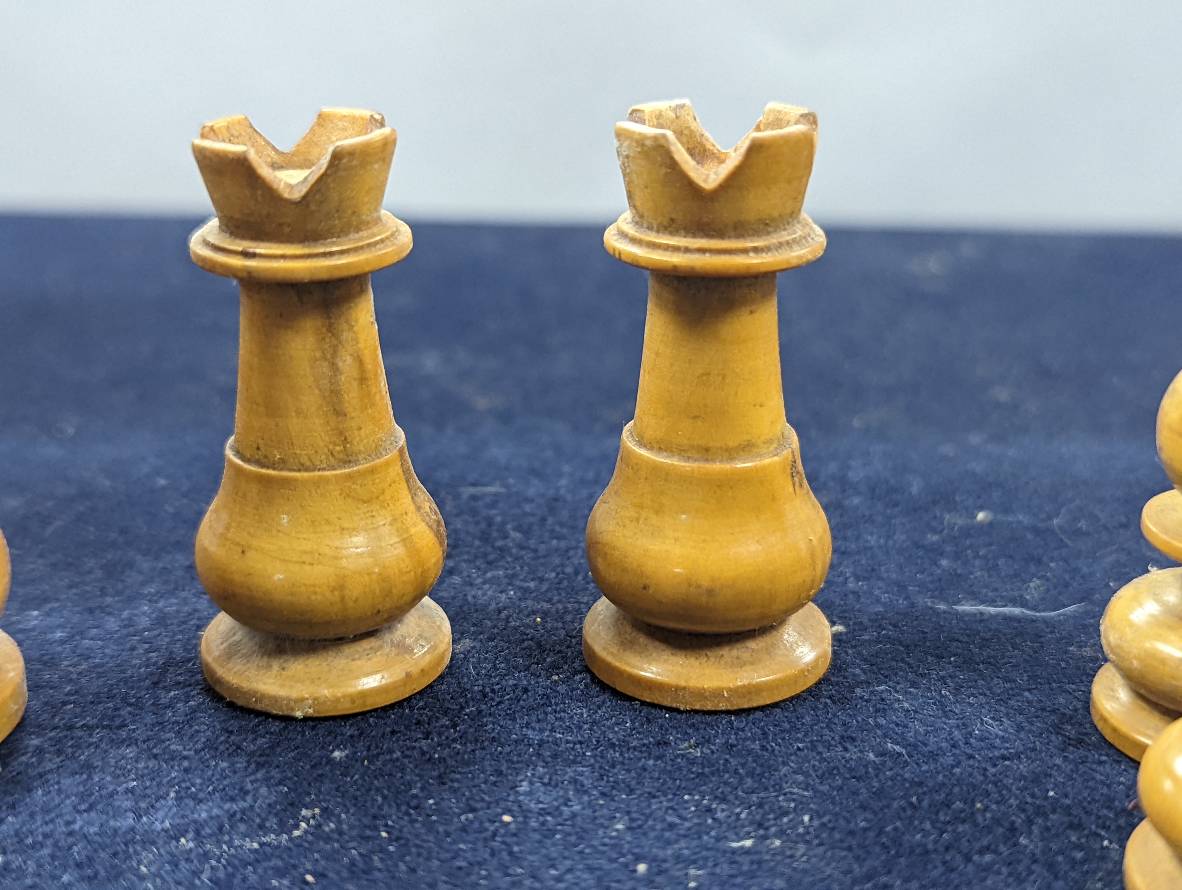 A Victorian brass inset mahogany games box, fitted with solitaire, cribbage, chessmen, draughts etc., 33cm, a turned and stained bone chess set, another games box containing chessmen and draughts